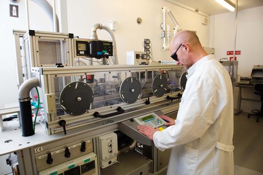 Scientist working inside one of Chempilots polymer facilities. 