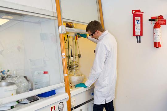 Scientist working inside one of Chempilots polymer labs.